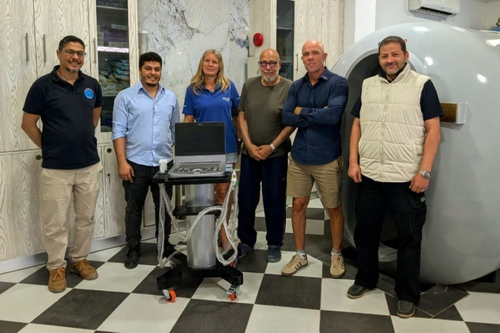 The medical teams and Emperor's representatives with the new Doppler machine